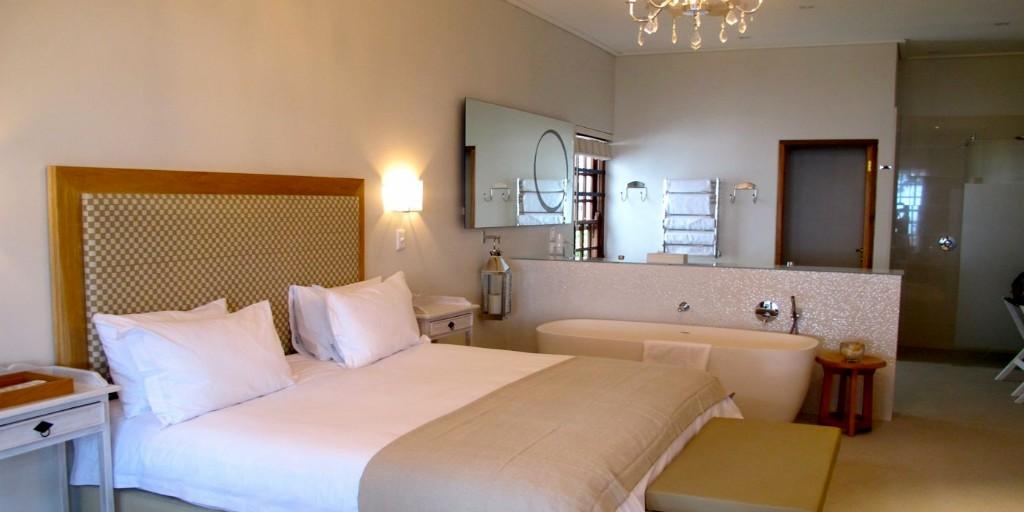 Luxury Rooms at Harbour House feature en-suite, open-plan bathroom with separate bath and shower